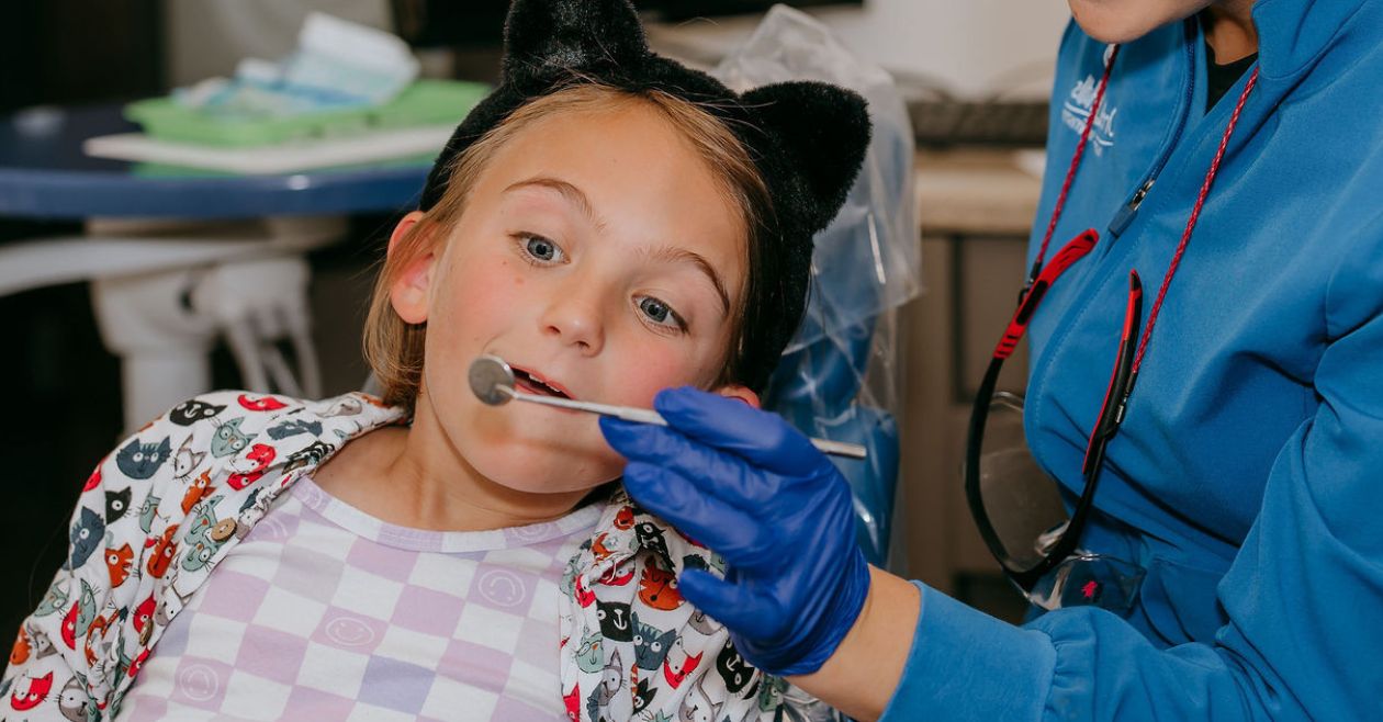 young girl checking out her smile
