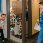 Mom and son walking into kid's dentist office