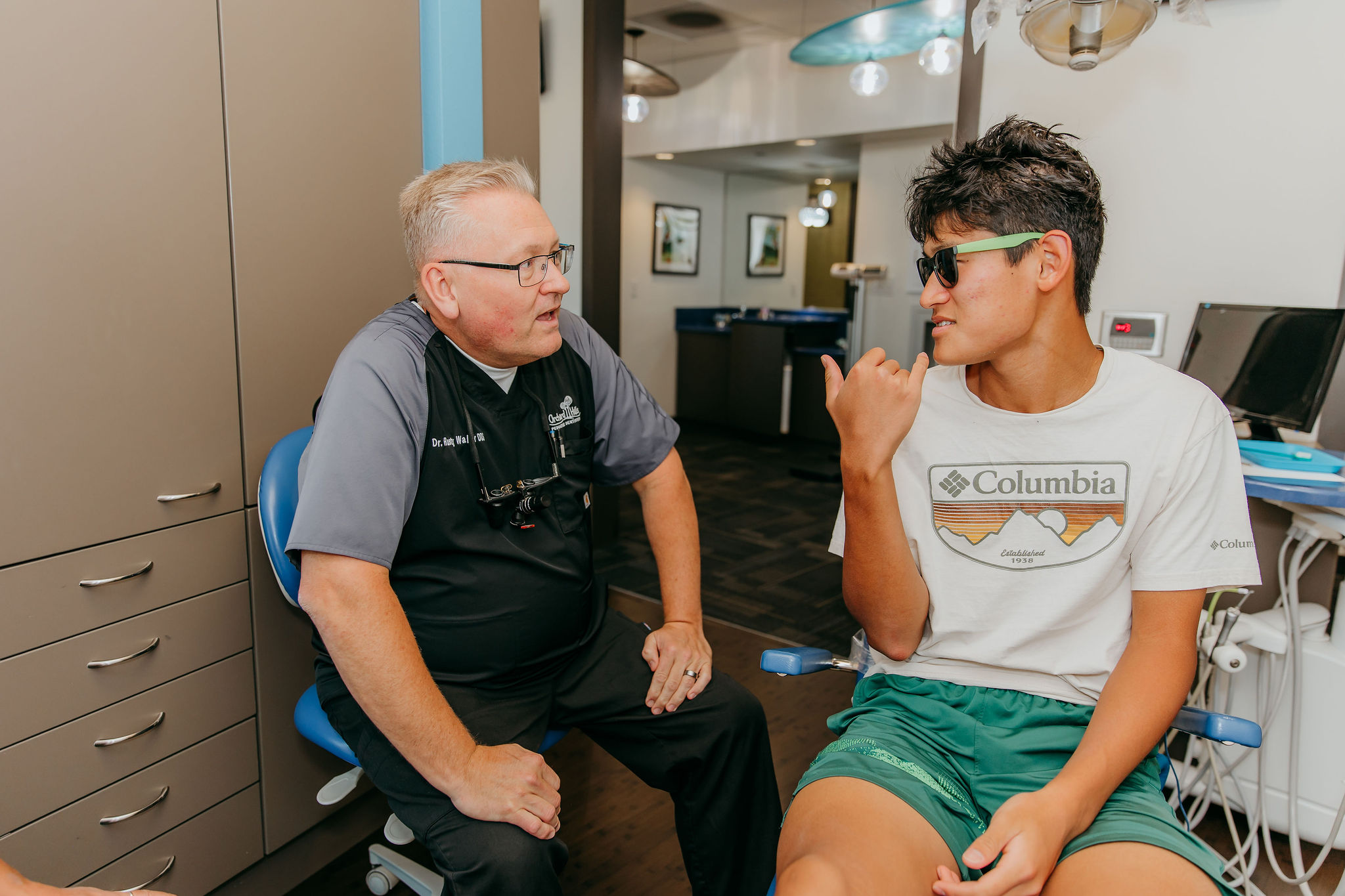 teenager talking to his peds dentist